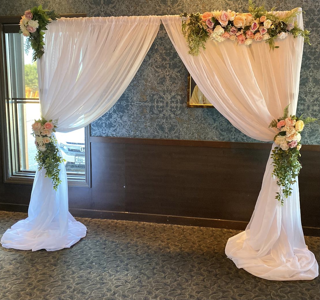 london flower arch with drapes